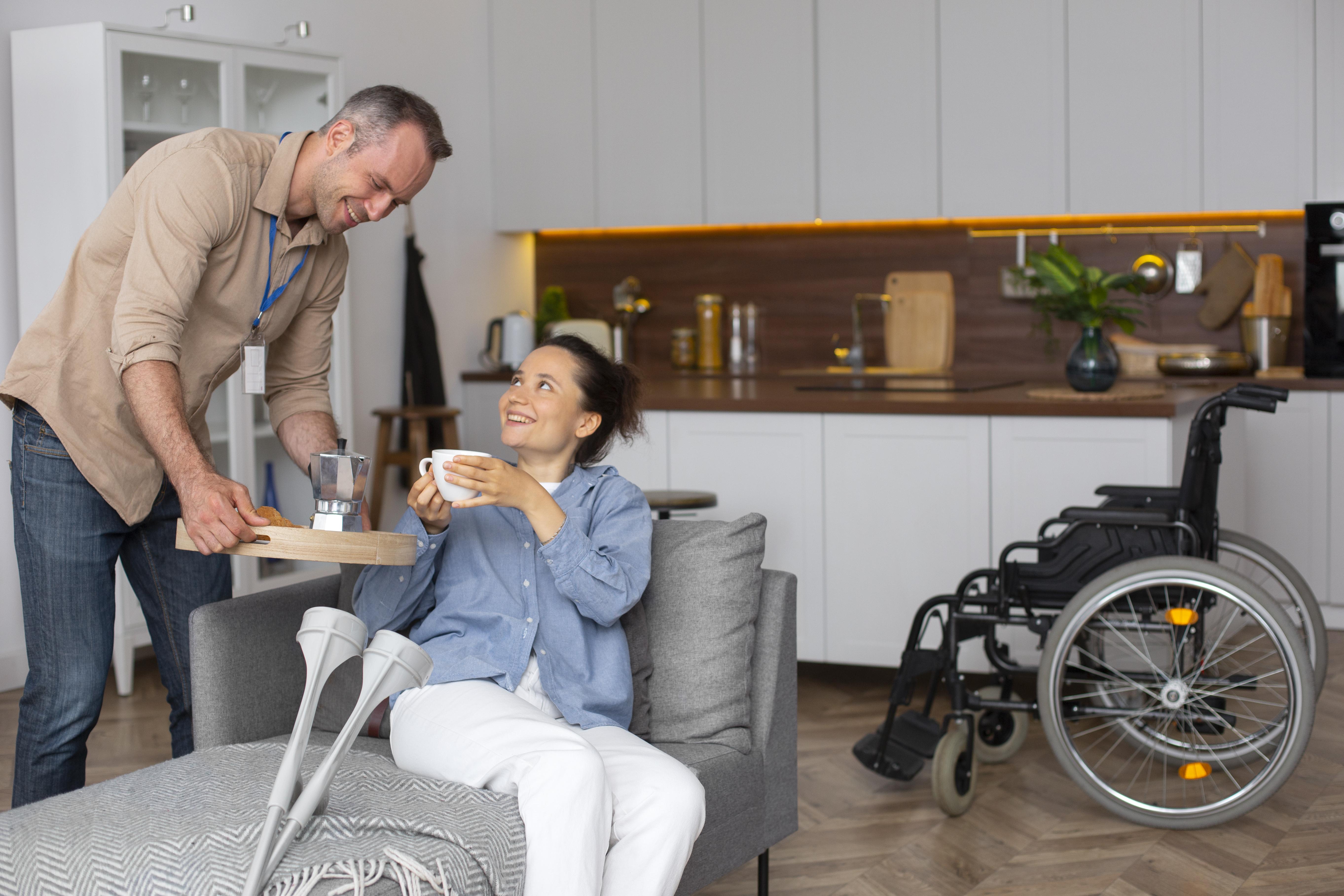 Man taking care of women with mobility challenges.